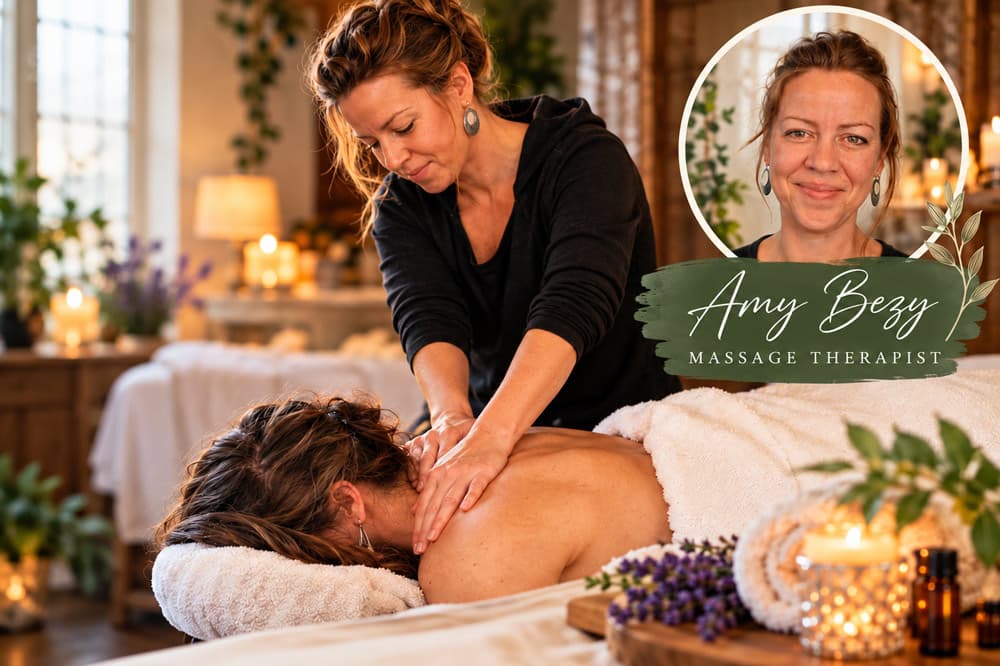 A massage therapist provides a relaxing treatment in a serene, candlelit room.